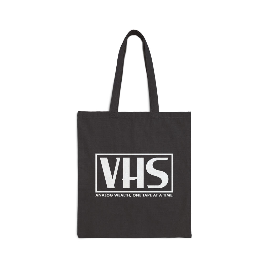 black tote bag featuring VHS analog wealth design in white