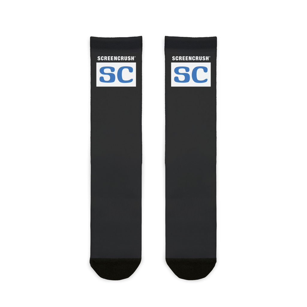 black crew socks with black heel and toe and white box with blue SC ScreenCrush rating design