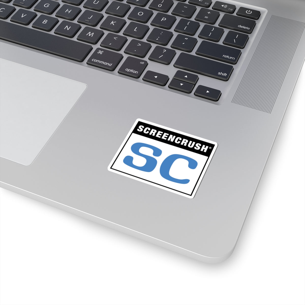 white sticker with SC rating in blue shown on laptop