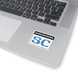 white sticker with SC rating in blue shown on laptop