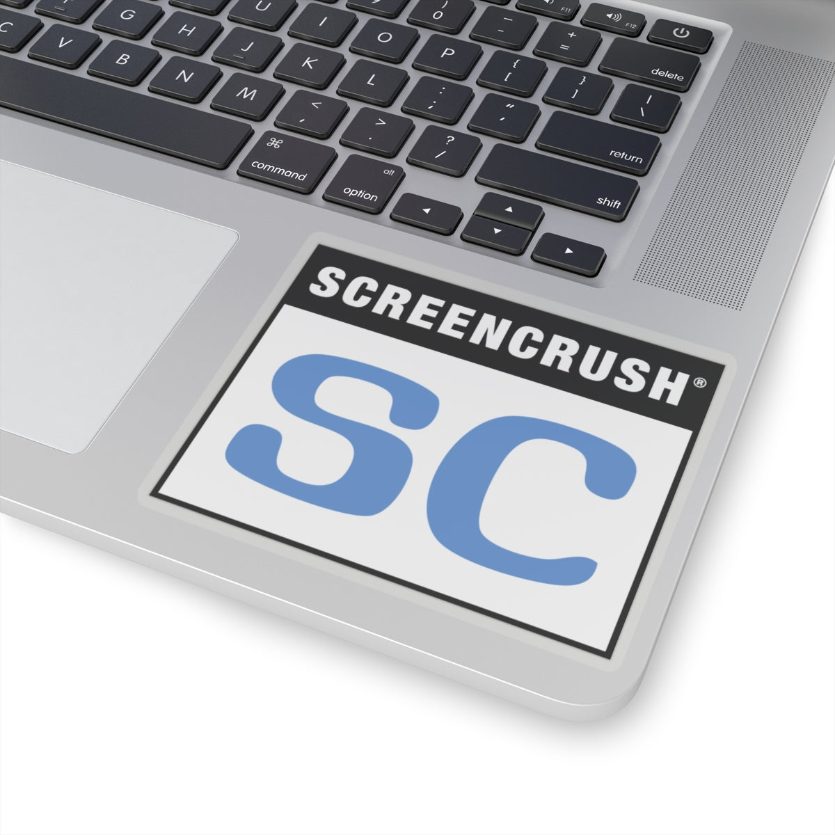 transparent sticker with SC rating in blue shown on laptop