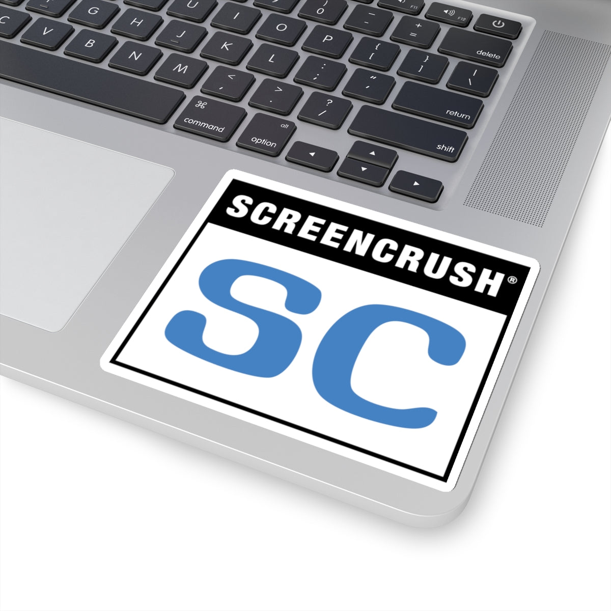 white sticker with SC rating in blue shown on laptop